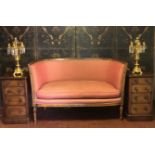 AN 18TH CENTURY STYLE MAHOGANY TWO SEAT SALON SETTEE Carved with swags, in a salmon pink and