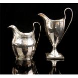 TWO GEORGIAN SILVER CREAM JUGS Classical helmet form with single handle, the smaller having engraved