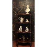 A VICTORIAN MAHOGANY FOUR TIER WHATNOT With pierced fretwork gallery and turned melon section