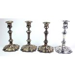A SET OF FOUR VICTORIAN SILVER GEORGIAN KNOPPED DESIGN CANDLESTICKS Having circular sconces and
