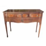 A REGENCY STYLE MAHOGANY BUFFET With two bow end drawers above one long drawer, raised on square