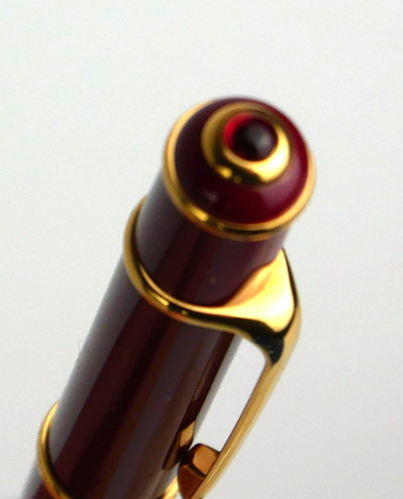 CARTIER, A VINTAGE BALLPOINT PEN Rouge case with gold plated clip, in a fitted Cartier box. ( - Image 4 of 4