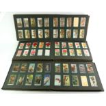 A COLLECTION OF THREE EARLY 20TH CENTURY CIGARETTE CARD ALBUMS To include Players dogs,