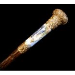 A 19TH CENTURY FRENCH PORCELAIN AND YELLOW METAL PARASOL Hand painted figural handle with gilt