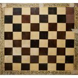 A 19TH CENTURY ANGLO INDIAN IVORY AND HARDWOOD CHESSBOARD The border having vizagapatam form