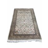 A LARGE ZIEGLER STYLE WOOLLEN RUG The central field woven with birds amongst foliage contained