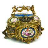 SÈVRES, A 19TH CENTURY LOUIS XIV EMPIRE STYLE BULBOUS GILDED ORMOLU JEWELLERY CASKET AND COVER The