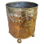 A LARGE 19TH CENTURY BRASS LOG BASKET Having twin lion mask handles and embossed decoration, on ball