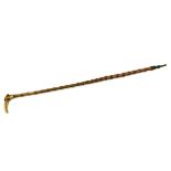 A VICTORIAN CARVED BONE AND BAMBOO COMICAL WALKING CANE The handle carved with the head of an