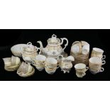 A 19TH CENTURY ENGLISH PORCELAIN TEA SERVICE Comprising a teapot, twelve cups and saucers, covered