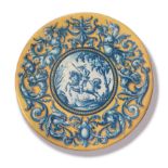 A SPANISH CLASSICAL DESIGN CHARGER The central blue and white panel decorated with a figure on