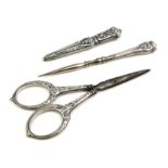 A 19TH CENTURY FRENCH SILVER SEWING SET Comprising a pair of scissors, needle case and threading