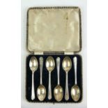 A SET OF SIX EARLY 20TH CENTURY SILVER 'GOLFING' TEASPOONS Each finial having crossed golf clubs