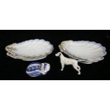 A SET OF FOUR ANTIQUE PORCELAIN SCALLOP SHELL FORM SHAPED DISHES With blue and gilt borders, bearing