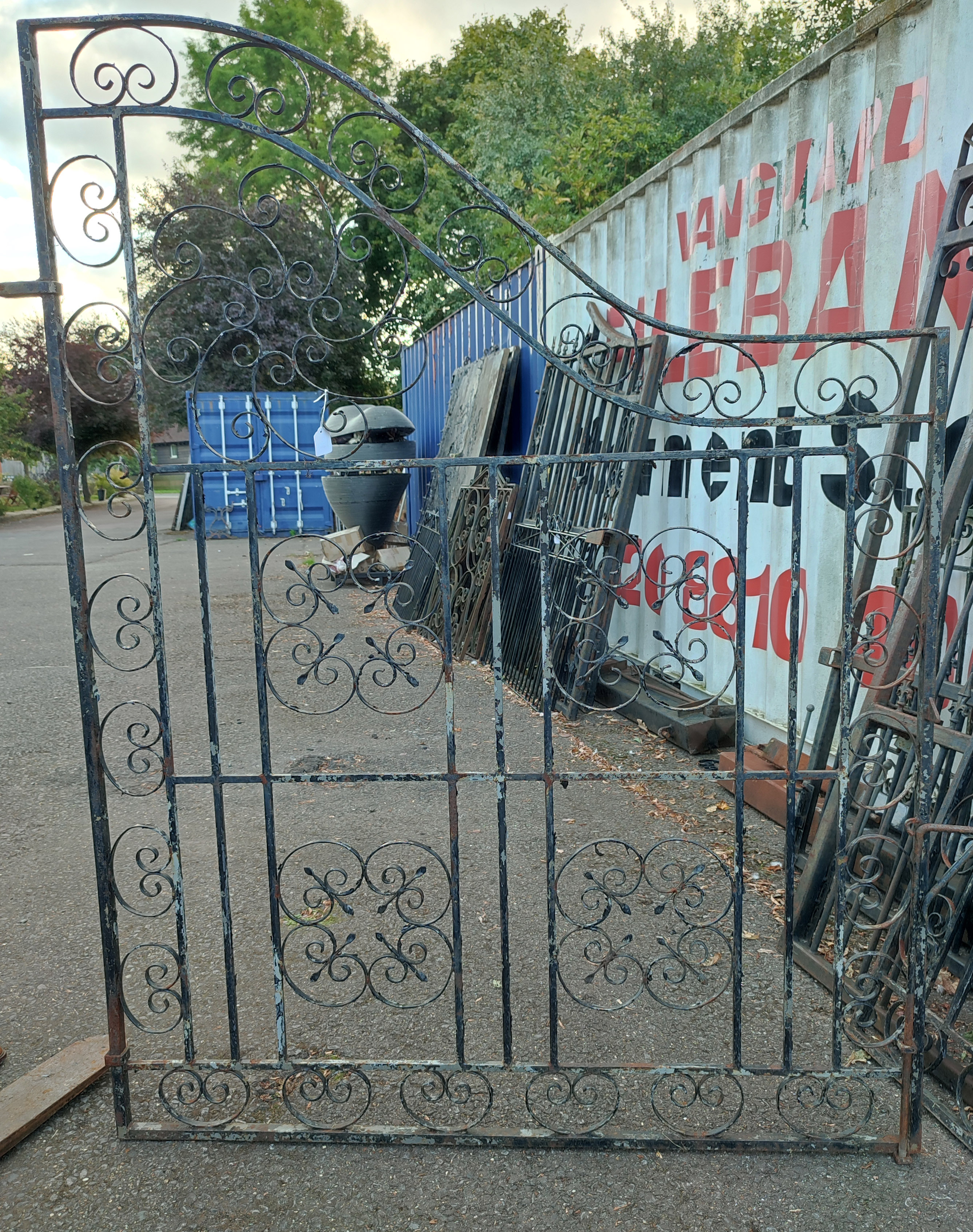 A PAIR OF LARGE VICTORIAN STYLE WROUGHT IRON DRIVEWAY GATES With traditional scrollwork panels. (w