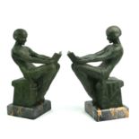 MAX LE VERRIER,, FRENCH, 1891 - 1973, A PAIR OF ART DECO SPELTER AND MARBLE BOOKENDS Seated