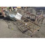 A VICTORIAN WROUGHT IRON COT Along with another. (140cm x 64cm x 96cm and 133cm x 59cm x 90cm)