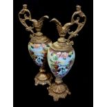 A LARGE PAIR OF VICTORIAN OPALINE GLASS AND SPELTER EWERS The single scroll handle having a winged