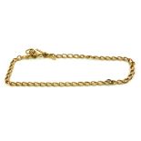 A 19TH CENTURY 18CT GOLD ALBERT WATCH CHAIN Having an oval form pierced chain and T bar. (approx