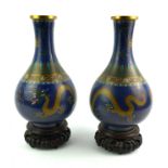 A PAIR OF CHINESE CLOISONNÉ VASES Decorated with dragons on a blue ground, bearing seal mark, on