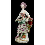 DERBY, AN 18TH CENTURY PORCELAIN 'FRUIT SELLER' FIGURE A maiden wearing period attire and carrying a