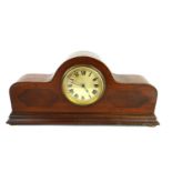 AN EDWARDIAN MAHOGANY BOUDOIR CLOCK With circular brass dial, inlaid panels and stringing to case,