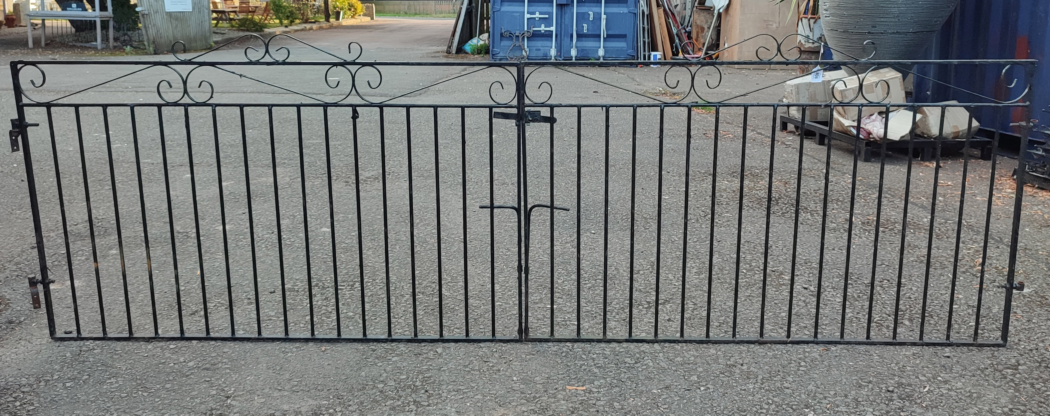 A PAIR OF STANDARD SIZE IRON SCROLL AND BAR DRIVEWAY GATES. (290cm x 94cm) Condition: good overall