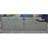 A PAIR OF STANDARD SIZE IRON SCROLL AND BAR DRIVEWAY GATES. (290cm x 94cm) Condition: good overall