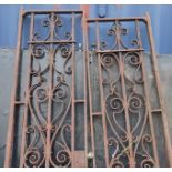 A PAIR OF VICTORIAN WROUGHT IRON TALL GATES With scrollwork panels. (109cm x 226cm) Condition: light