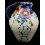 DORA TENNANT, AN ART DECO POTTERY JUG Hand painted with a geometric floral pattern, bearing black