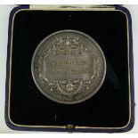 AN EARLY 20TH CENTURY SILVER 'CITY AND GUILDS OF LONDON INSTITUTE' SPHERICAL MEDAL Awarded for