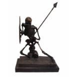 A 20TH CENTURY BRONZE FIGURE OF A SKELETON WARRIOR In battle pose with embossed portrait of Medusa