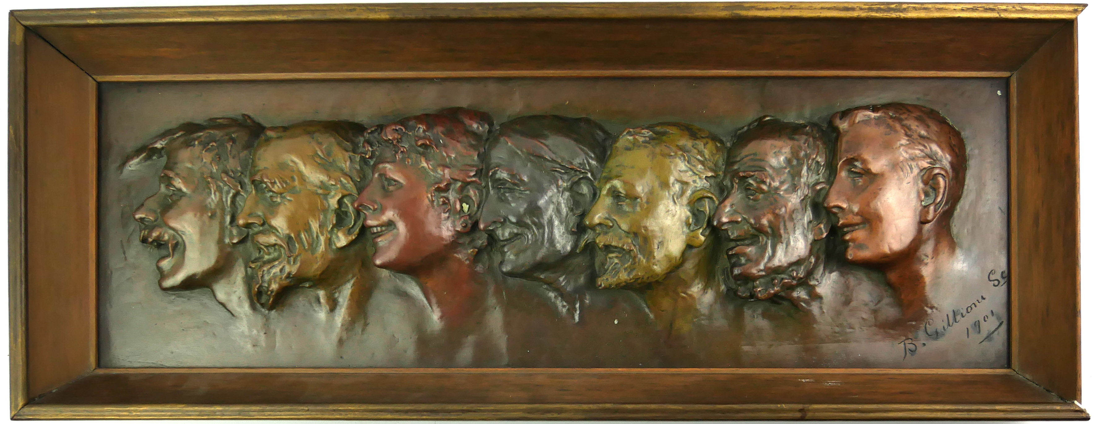 AN EARLY 20TH CENTURY CONTINENTAL BRONZE GROUP RECTANGULAR PORTRAIT PLAQUE With seven embossed heads