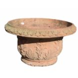 A TERRACOTTA PLANTER With moulded organic decoration. (diameter 67cm x 37cm) Condition: some minor