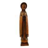A CONTINENTAL ART DECO PERIOD LIMEWOOD CARVING OF VIRGIN MARY STANDING ON A GLOBE, CIRCA 1930