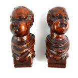 A PAIR OF CARVED WOODEN CLASSICAL PORTRAIT BUSTS Male figures with scrolls to base and mounting