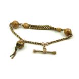 A VICTORIAN YELLOW METAL ALBERTINA WATCH CHAIN Rope twist chain with spherical spacer links,