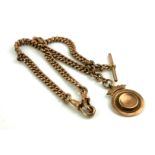 A VICTORIAN 9CT GOLD DOUBLE ALBERT WATCH CHAIN Having tapering links with T bar and fob. (approx