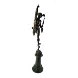 AN EARLY 20TH CENTURY BRONZE STATUE OF EROS On a circular tapering green marble plinth. (64cm)