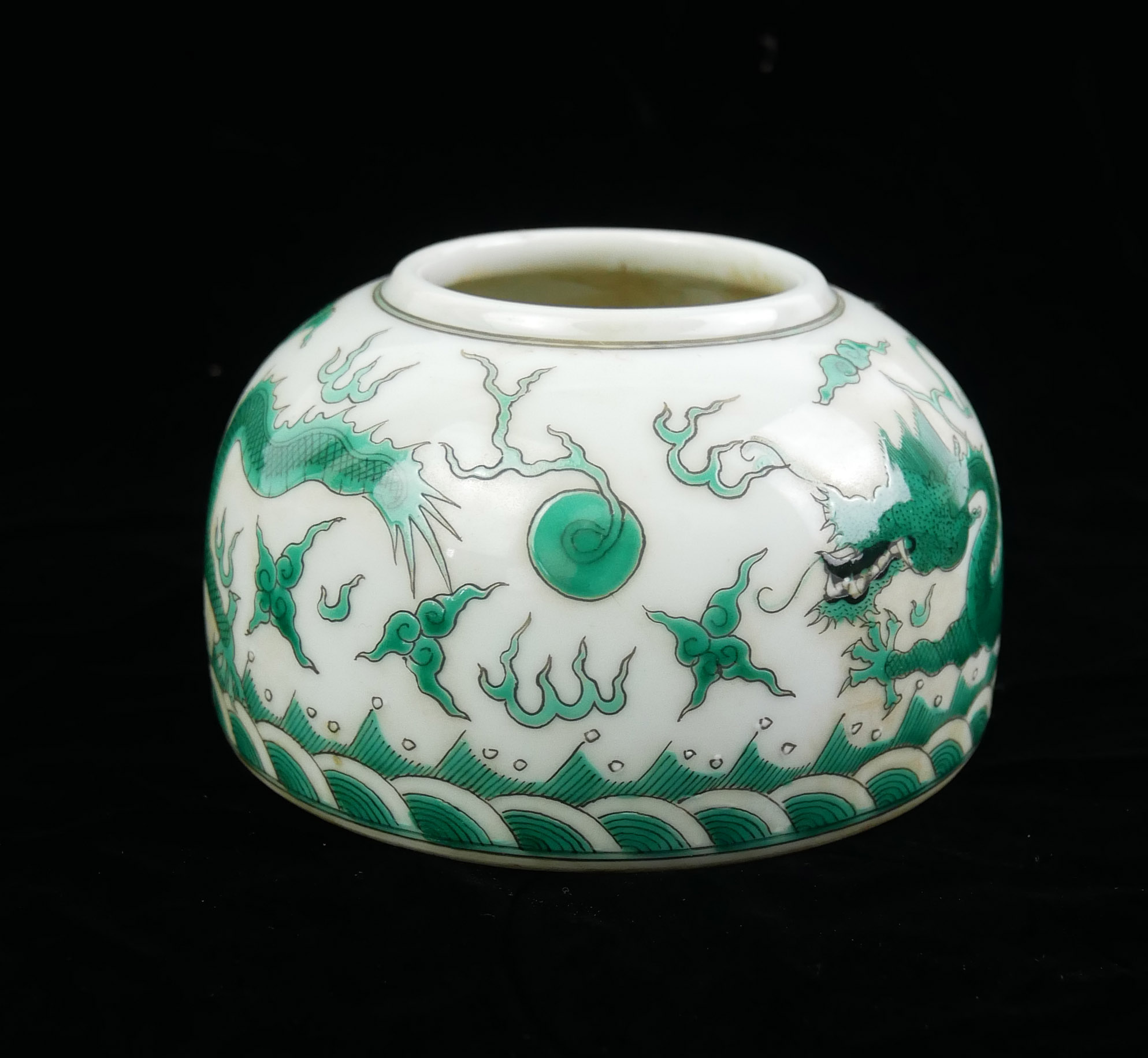 A CHINESE PORCELAIN SPHERICAL 'DRAGON' INKWELL With green opposing dragons chasing a flaming