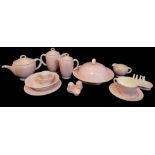 SUSIE COOPER, A COLLECTION OF ART DECO POTTERY TABLEWARE To include a pink star breakfast set with