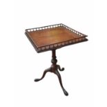 AN 18TH CENTURY MAHOGANY TILT TOP TRIPOD TABLE With square spindles galleried top above a bird cage,