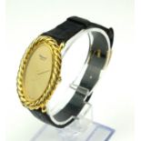 CHOPARD, AN 18CT GOLD LADIES' WRISTWATCH Oval dial with rope twist bezel and mechanical movement, on