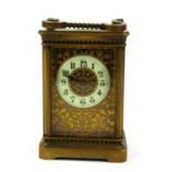 A LATE 19TH/EARLY 20TH CENTURY GILT BRASS CARRIAGE CLOCK Having a single carry handle, four bevelled
