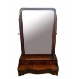 A GEORGE III SOLID MAHOGANY SERPENTINE DRESSING TABLE MIRROR With four drawers, raised on bracket