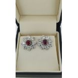 A PAIR OF 18CT WHITE GOLD, 1CT RUBY AND 3.41CT DIAMOND EARRINGS. (w 14mm)