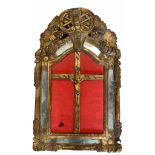 AN 18TH CENTURY CONTINENTAL IVORY CRUCIFIX SET IN A CARVED GILTWOOD FRAME Decorated with flowerheads