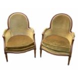 A PAIR OF LOUIS XV DESIGN CARVED WOOD AND UPHOLSTERED BERGERE ARMCHAIRS Raised on fluted legs.