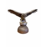 A GERMAN WW2 PERIOD CAR MASCOT, In the form of a large eagle with outspread wings from a Military