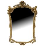 A LARGE 19TH CENTURY CARVED GILTWOOD AND GESSO MIRROR The shaped mercury plate glass house in a